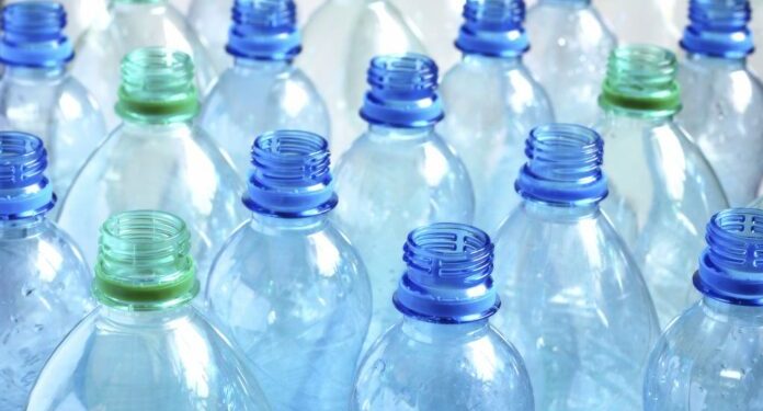 Many empty water bottles. Shallow DOF.