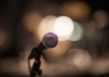detail of a microphone with some bokeh on background