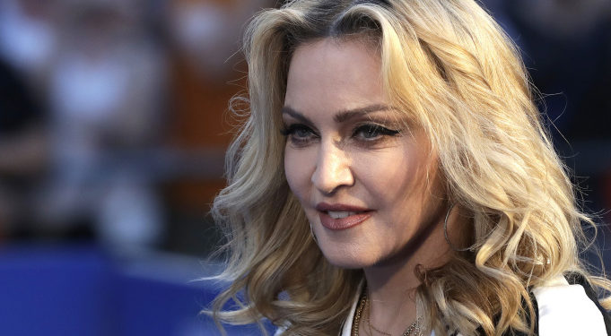 Musician Madonna poses for photographers upon arrival at the World premiere of the film 'The Beatles, Eight Days a Week' in London, Thursday, Sept. 15, 2016. (AP Photo/Kirsty Wigglesworth)