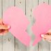 Couple holding two halves of broken heart against wooden background; Shutterstock ID 362866388; PO: KTRK