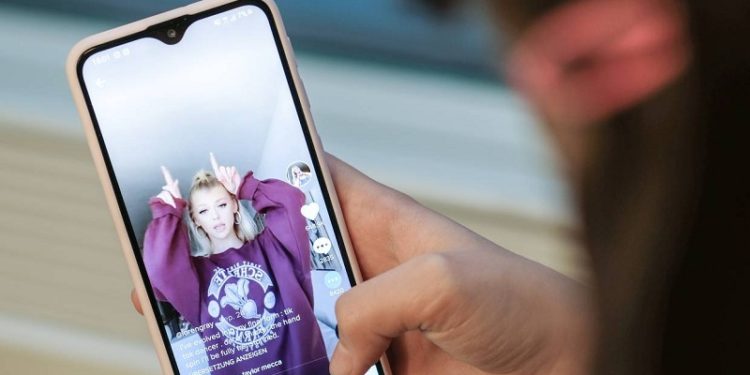 ILLUSTRATION - TikTok started out as a lip-syncing app, but has developed into a broad video platform for teenagers who want to share what they're up to. Photo: Jens Kalaene/dpa-Zentralbild/dpa