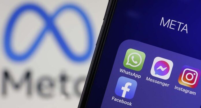 PARIS, FRANCE - FEBRUARY 03: In this photo illustration, The logos of applications, WhatsApp, Messenger, Instagram and facebook belonging to the company Meta are displayed on the screen of an iPhone in front of a Meta logo on February 03, 2022 in Paris, France. Share prices for Facebook's parent company, Meta, slumped in after-hours trading after the company reported that social network's daily active users declined to 1.929 billion in Q4 of 2021 from 1.930 billion in the previous quarter. Facebook is losing users for the first time in its history, Mark Zuckerberg's company has seen its profits decline, and the transition to the metaverse promises to be chaotic. (Photo illustration by Chesnot/Getty Images)