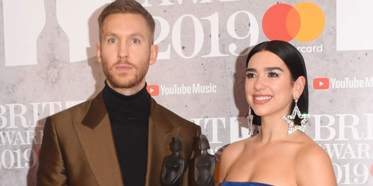LONDON, ENGLAND - FEBRUARY 20: (EDITORIAL USE ONLY) Dua Lipa and Calvin Harris in the winners room during The BRIT Awards 2019 held at The O2 Arena on February 20, 2019 in London, England. (Photo by Stuart C. Wilson/Getty Images)
