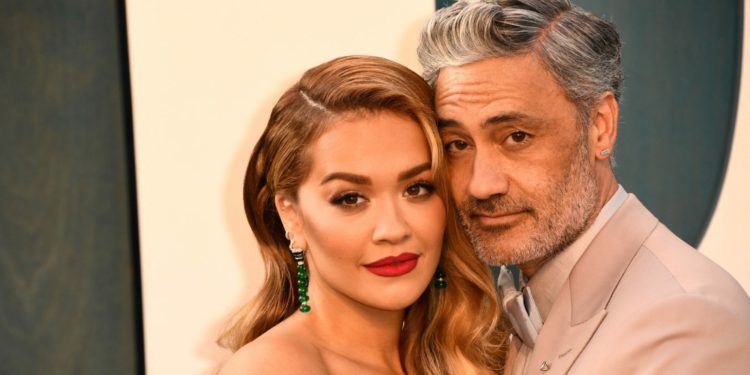 Taika Waititi and Rita Ora attend the 2022 Vanity Fair Oscar Party following the 94th Oscars at the The Wallis Annenberg Center for the Performing Arts in Beverly Hills, California on March 27, 2022. (Photo by Patrick T. FALLON / AFP)