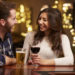 Couple Enjoying Evening Drinks In Bar