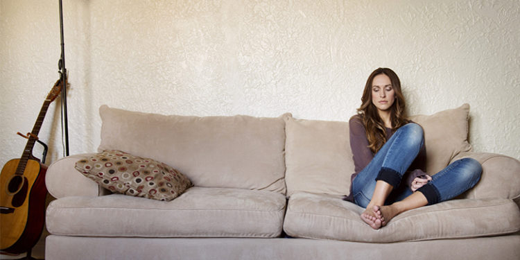 Woman Alone Resting On Couch